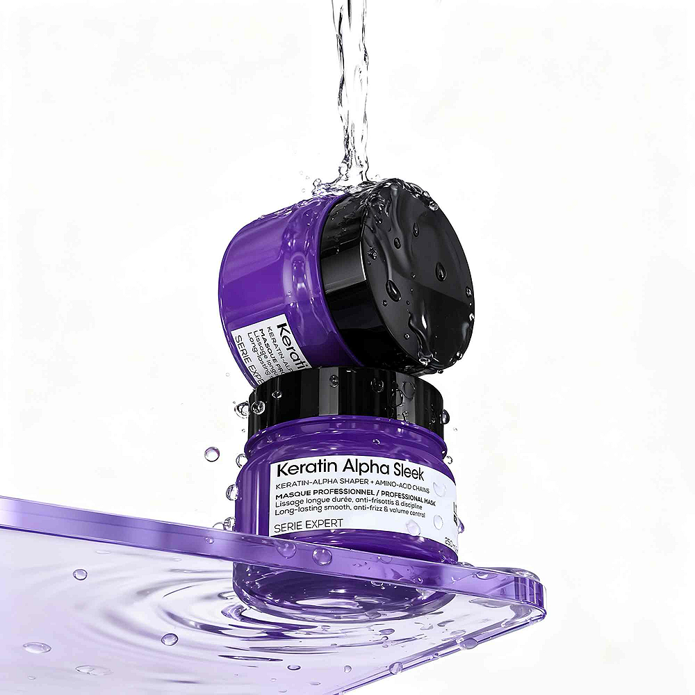 Stacked purple Keratin Alpha Sleek hair masks with water splashes, salon hair care product